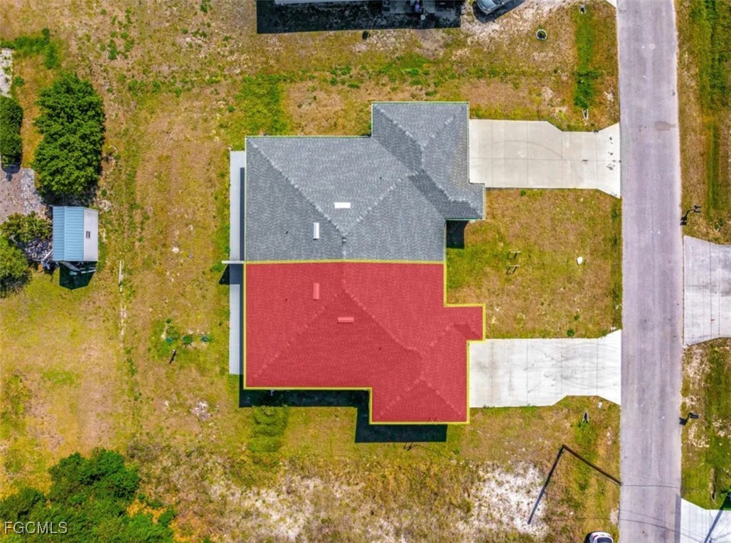4414 28th Street Southwest Lehigh Acres, FL 33973 - Photo 26 of 29 an aerial view of residential houses with yard