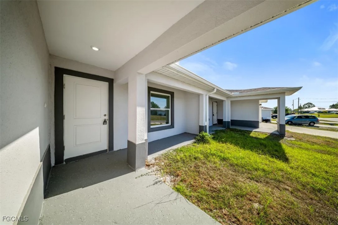4414 28th Street Southwest Lehigh Acres, FL 33973 - Photo 4 of 29 a view of a house with backyard and porch
