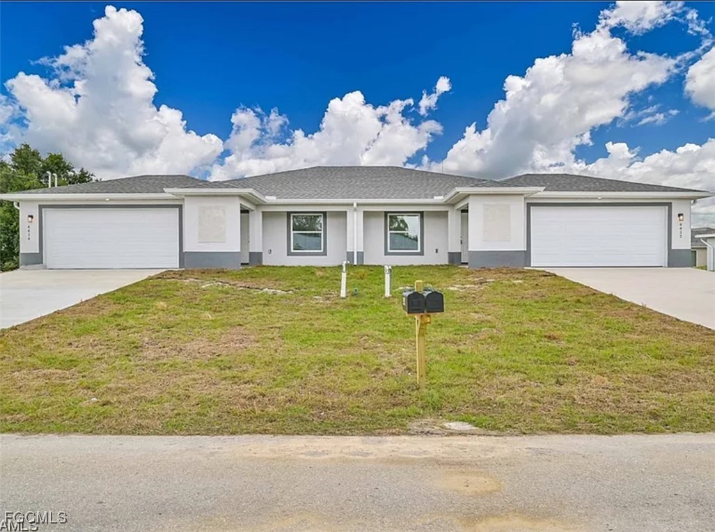 4414 28th Street Southwest Lehigh Acres, FL 33973 - Photo 5 of 29 front view of house with yard