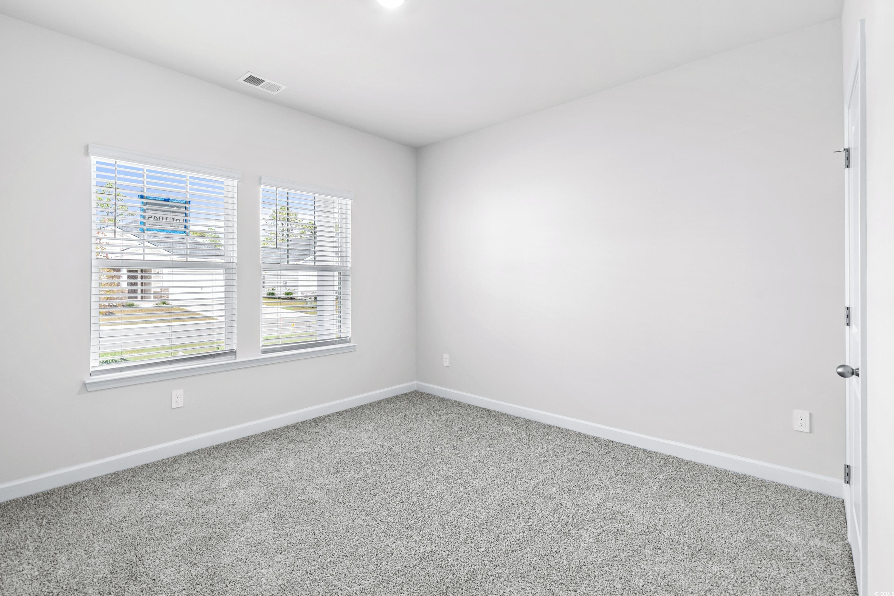 8616 Pinnacle Cv Way Longs, SC 29568 - Photo 23 of 32 Spare room featuring carpet