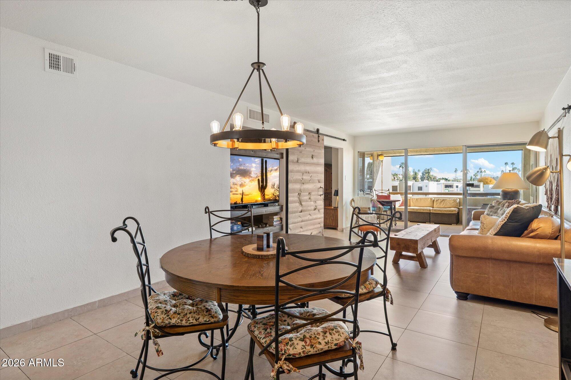 7625 East Camelback Road, Unit B325 Scottsdale, AZ 85251 - Photo 1 of 24 a view of a dining room with furniture window and outside view