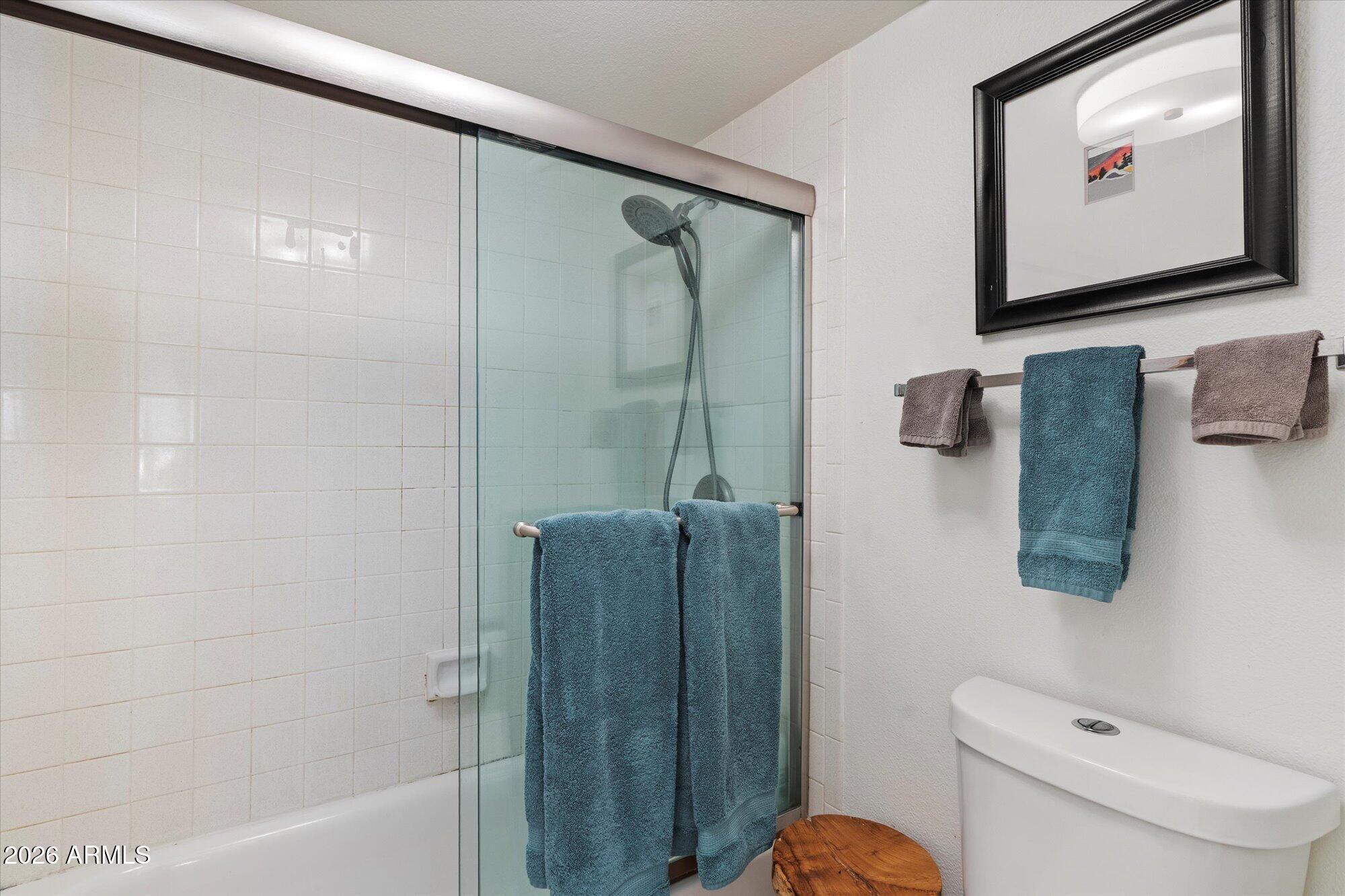 7625 East Camelback Road, Unit B325 Scottsdale, AZ 85251 - Photo 15 of 24 a bathroom with a shower a toilet and sink