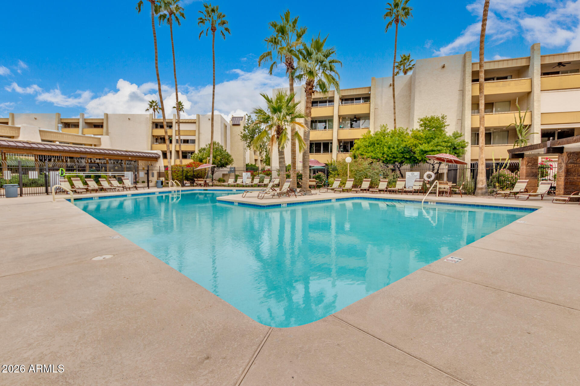 7625 East Camelback Road, Unit B325 Scottsdale, AZ 85251 - Photo 19 of 24 a view of a swimming pool with a lake view