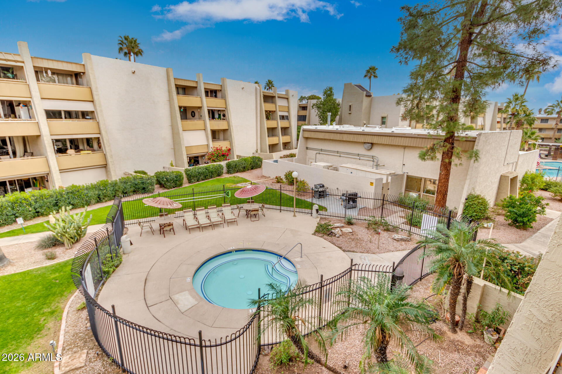 7625 East Camelback Road, Unit B325 Scottsdale, AZ 85251 - Photo 22 of 24 an aerial view of a house with swimming pool and furniture