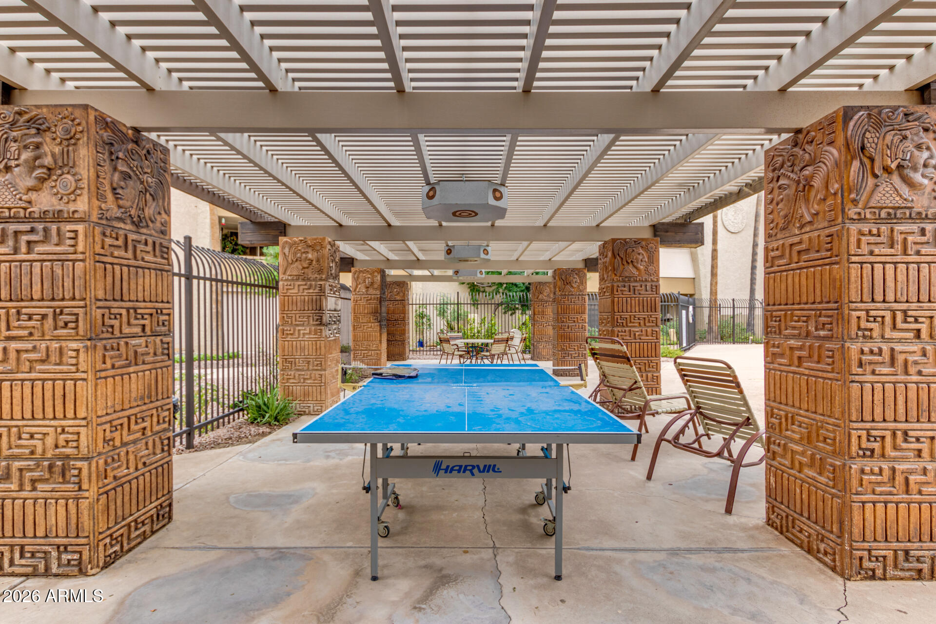 7625 East Camelback Road, Unit B325 Scottsdale, AZ 85251 - Photo 23 of 24 a view of patio with table and chairs and potted plants