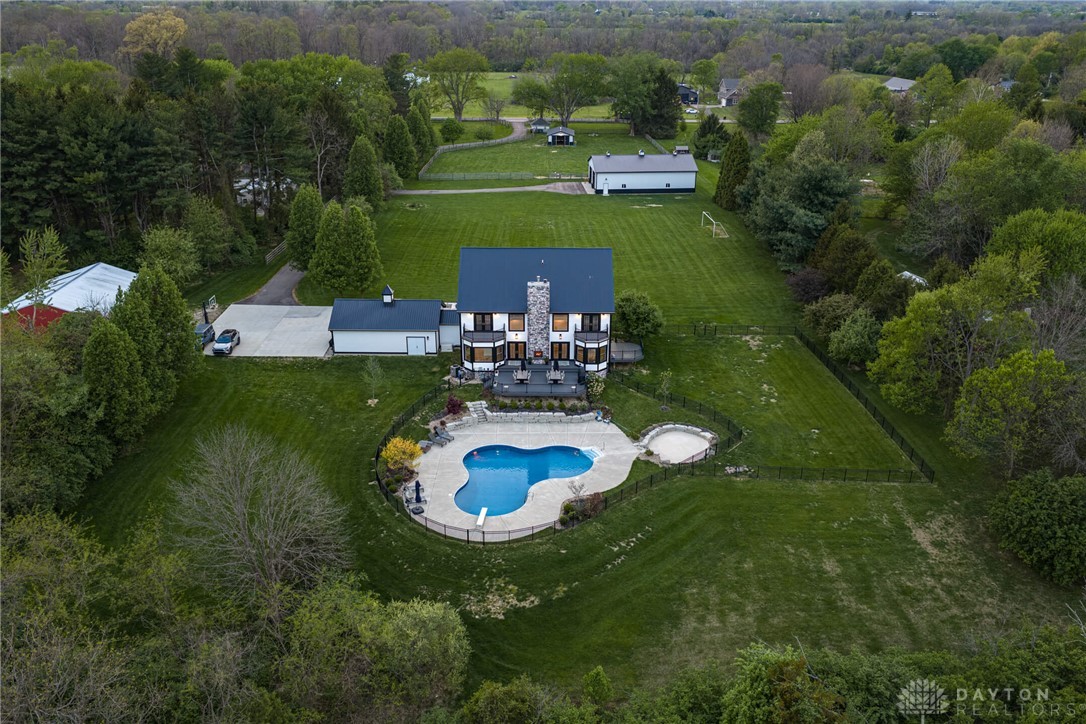 9586 Ferry Road Waynesville, OH 45068 - Photo 35 of 40 An aerial view showcases a grand estate with a private pool and expansive green grounds.