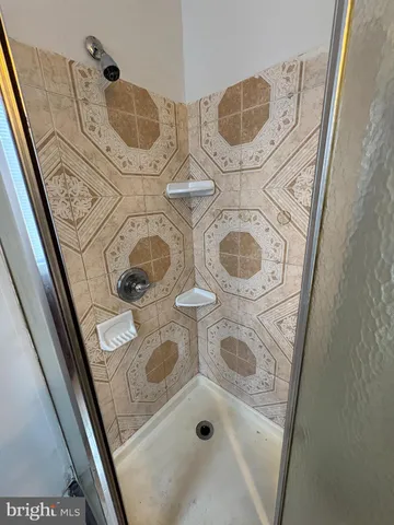 a bathroom with a sink toilet and mirror