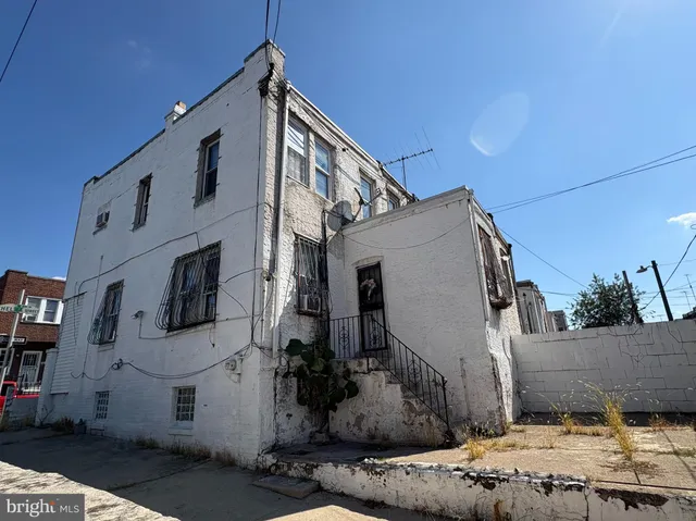 a view of a house with a street