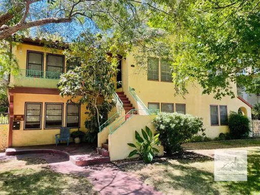 a view of a house with a yard