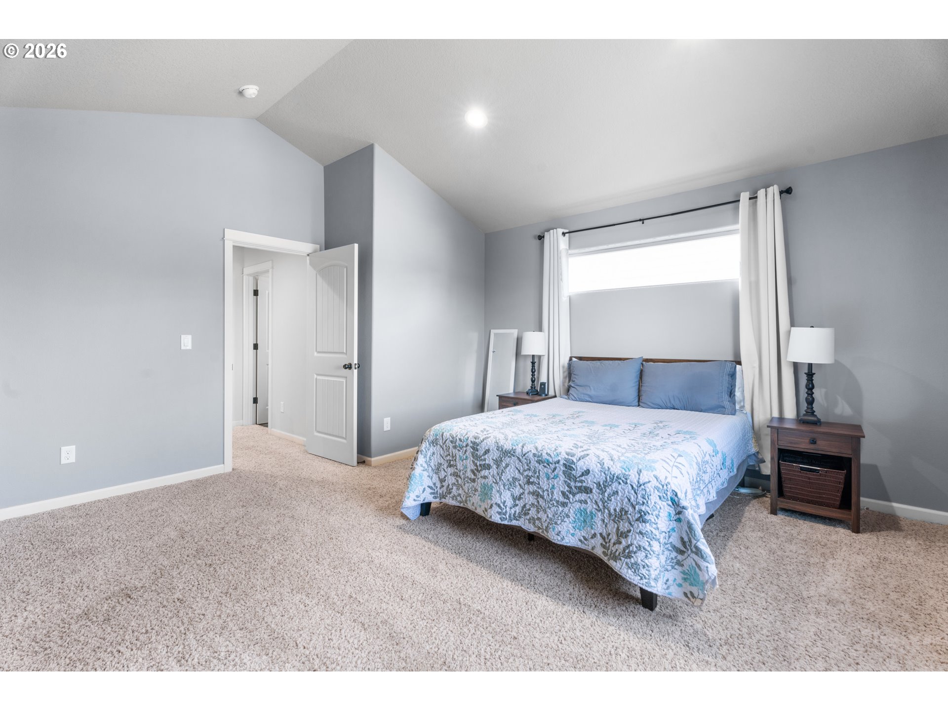 218 Finneys Avenue Molalla, OR 97038 - Photo 15 of 34 a bedroom with a large bed and a chandelier