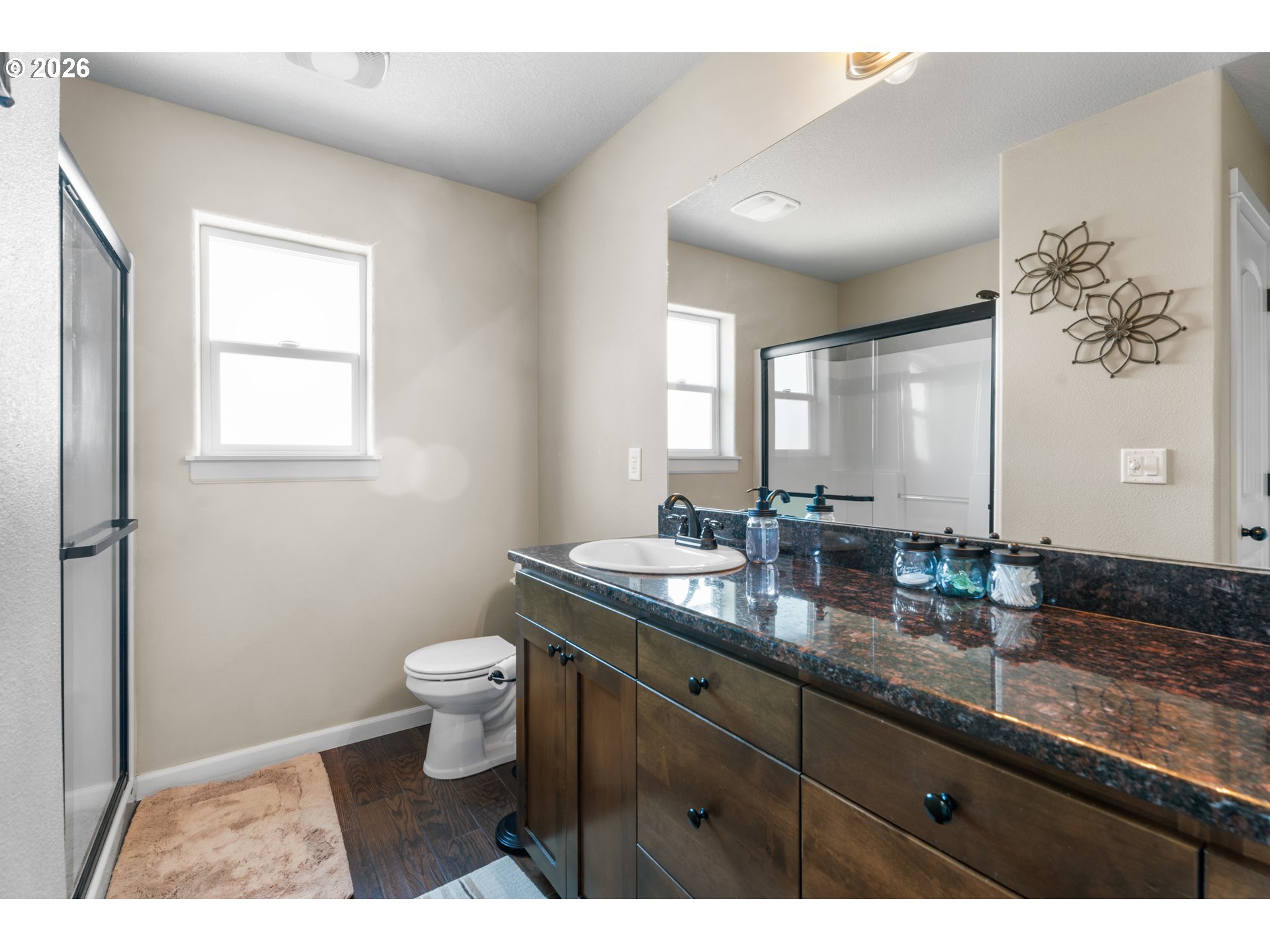 218 Finneys Avenue Molalla, OR 97038 - Photo 17 of 34 a bathroom with a granite countertop toilet sink and mirror