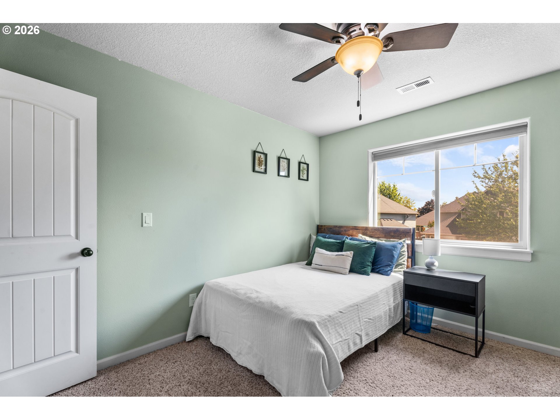 218 Finneys Avenue Molalla, OR 97038 - Photo 19 of 34 a bedroom with a bed and a chandelier