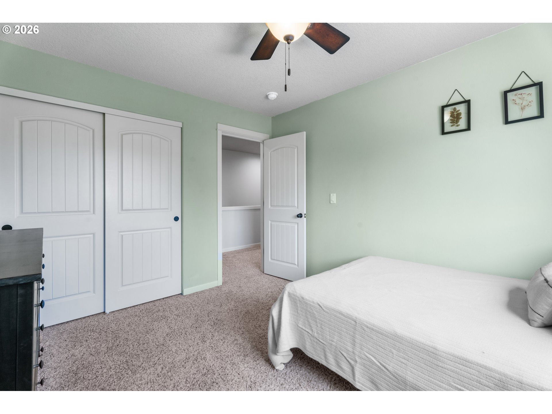 218 Finneys Avenue Molalla, OR 97038 - Photo 21 of 34 a bedroom with a bed and a chandelier