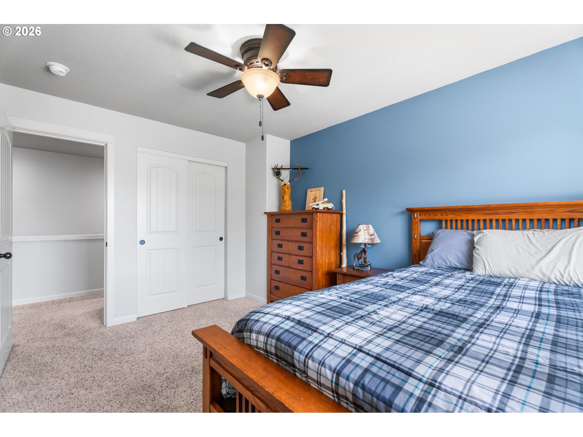 218 Finneys Avenue Molalla, OR 97038 - Photo 24 of 34 a bedroom with a large bed and a chandelier