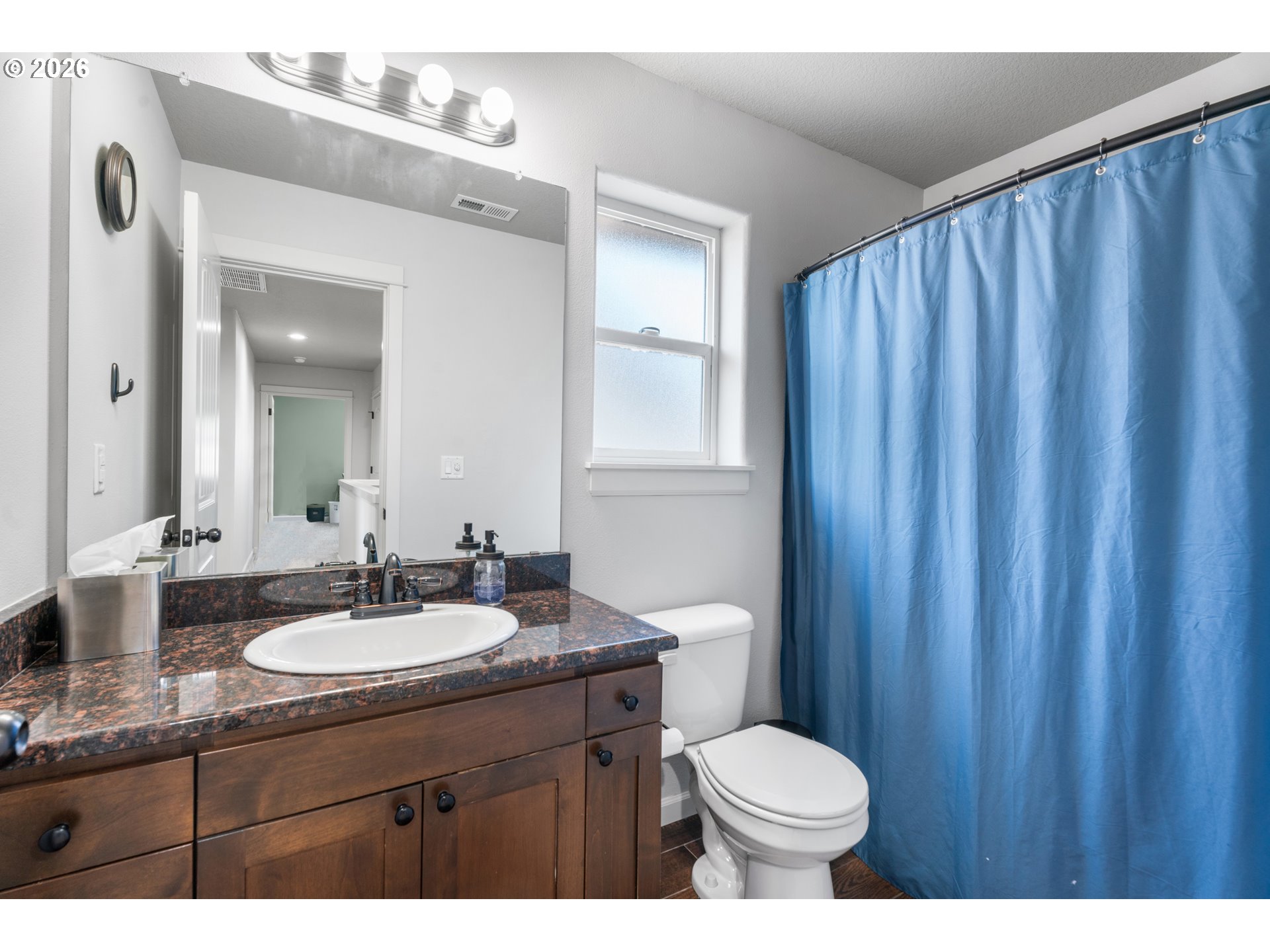 218 Finneys Avenue Molalla, OR 97038 - Photo 29 of 34 a bathroom with a sink vanity mirror and toilet