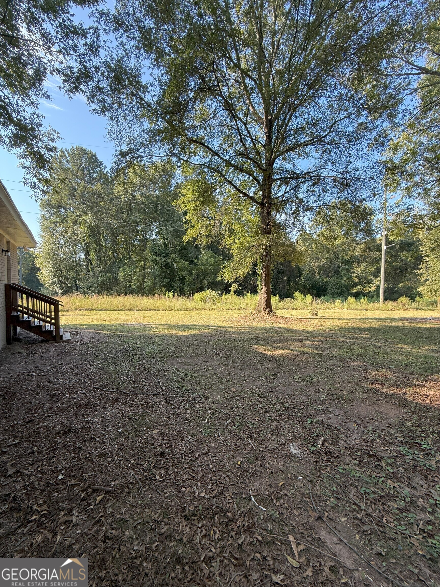516 Harris Street Monroe, GA 30655 - Photo 19 of 25 a view of outdoor space with trees