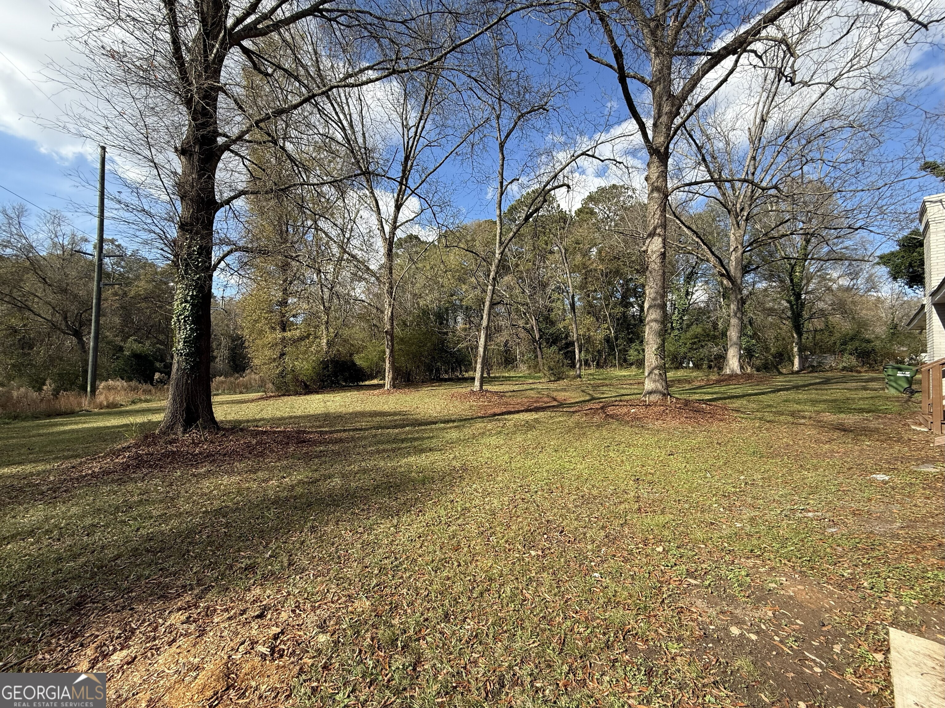 516 Harris Street Monroe, GA 30655 - Photo 21 of 25 a view of a house with a yard
