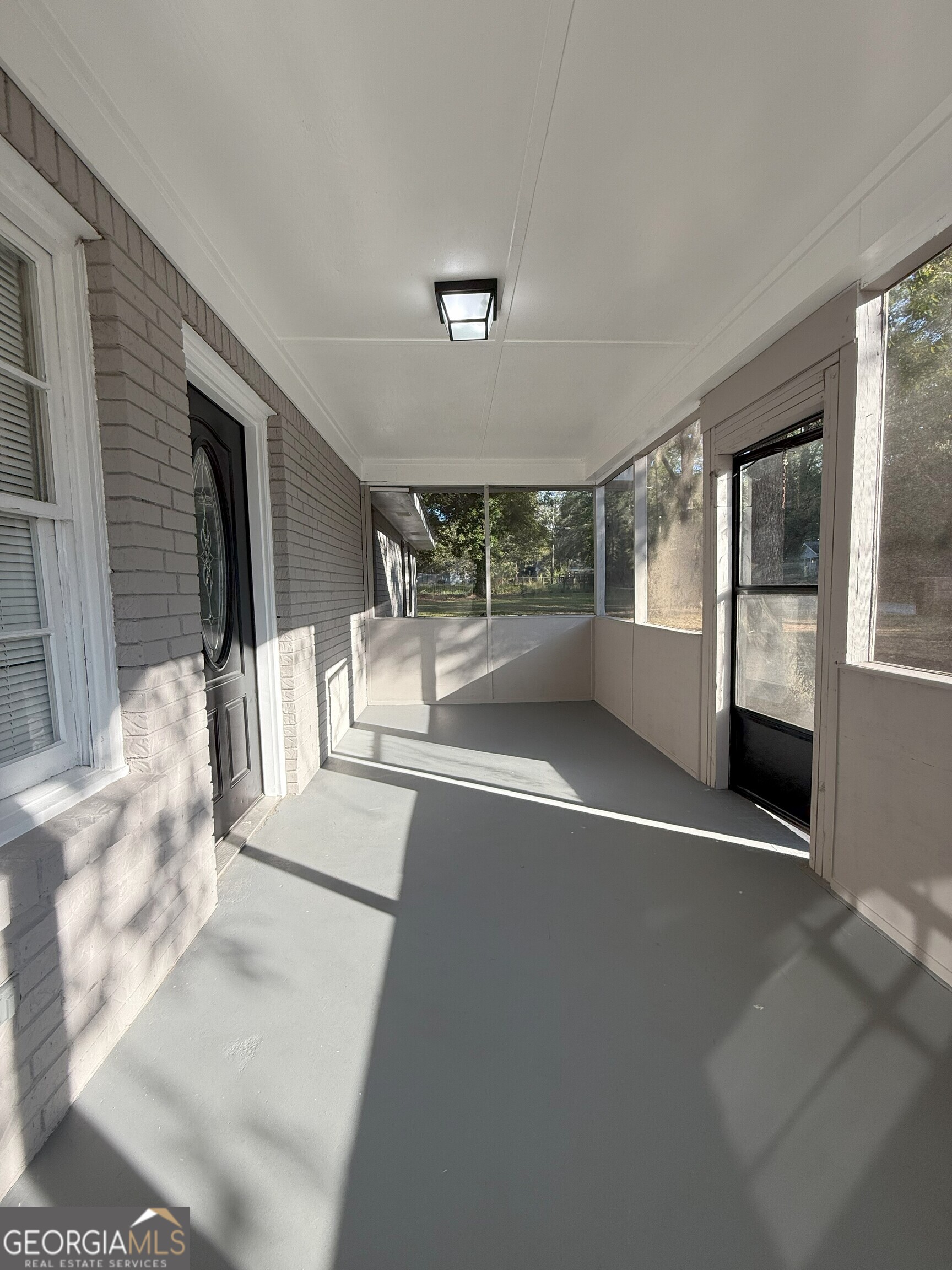 516 Harris Street Monroe, GA 30655 - Photo 4 of 25 a view of a living room with hardwood