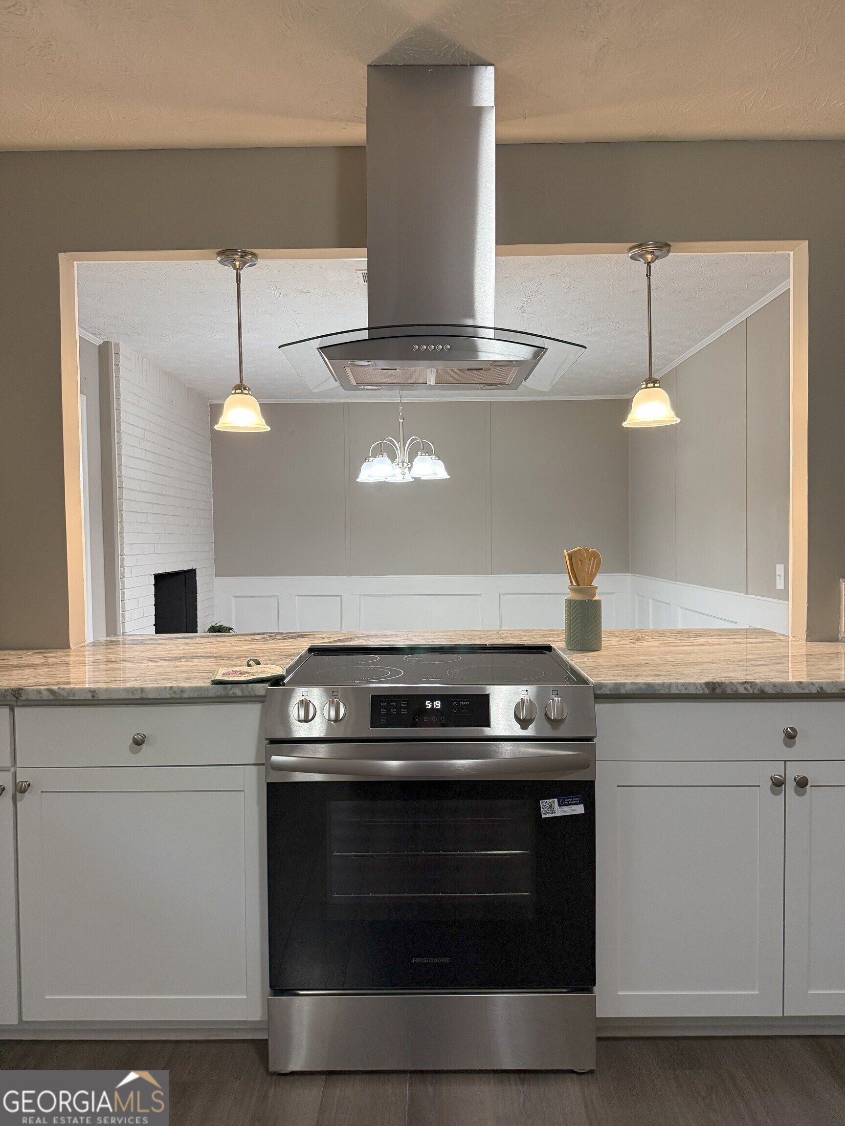 516 Harris Street Monroe, GA 30655 - Photo 6 of 25 a stove top oven sitting inside of a kitchen
