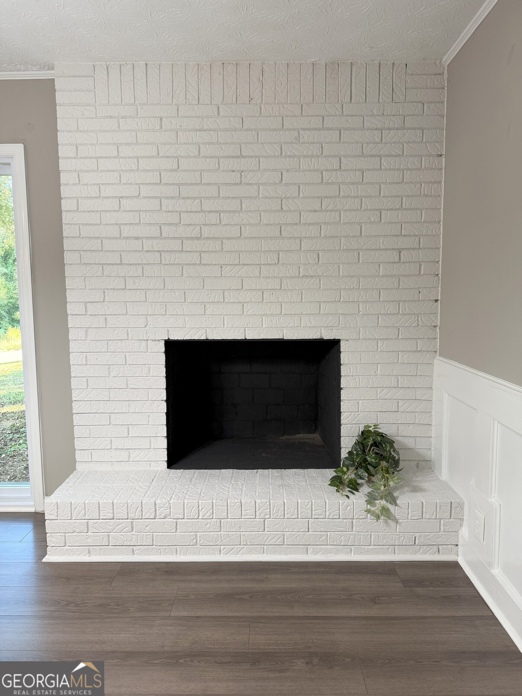 516 Harris Street Monroe, GA 30655 - Photo 9 of 25 a living room with a fireplace