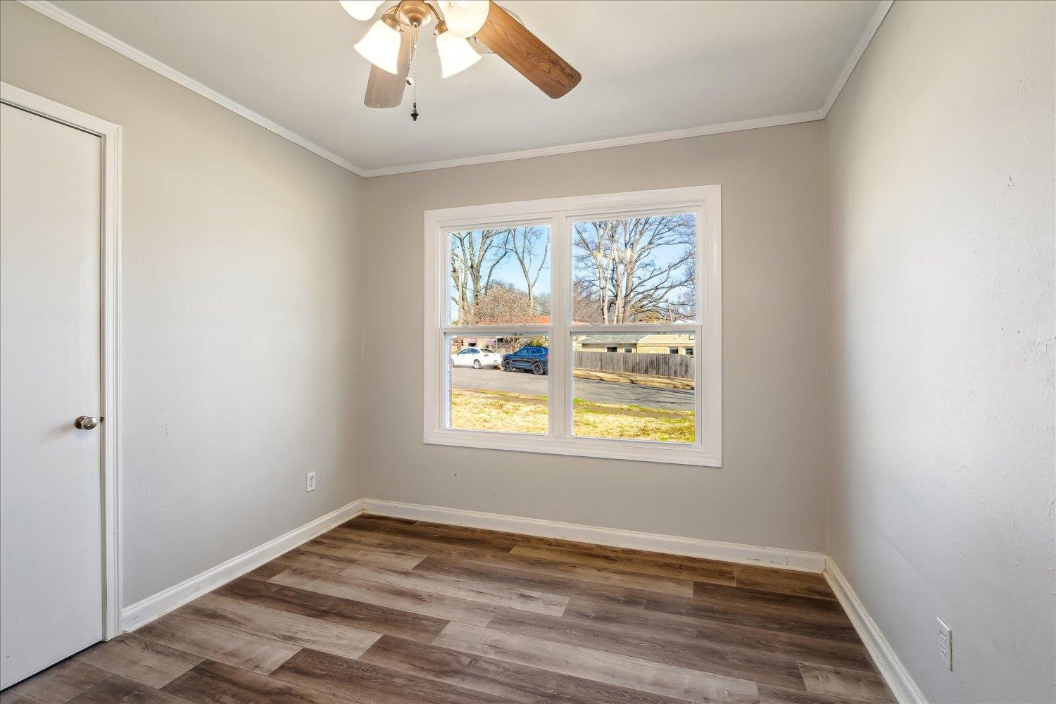 3901 Lytle Circle Memphis, TN 38122 - Photo 21 of 30 Empty room with ornamental molding, baseboards, and wood finished floors