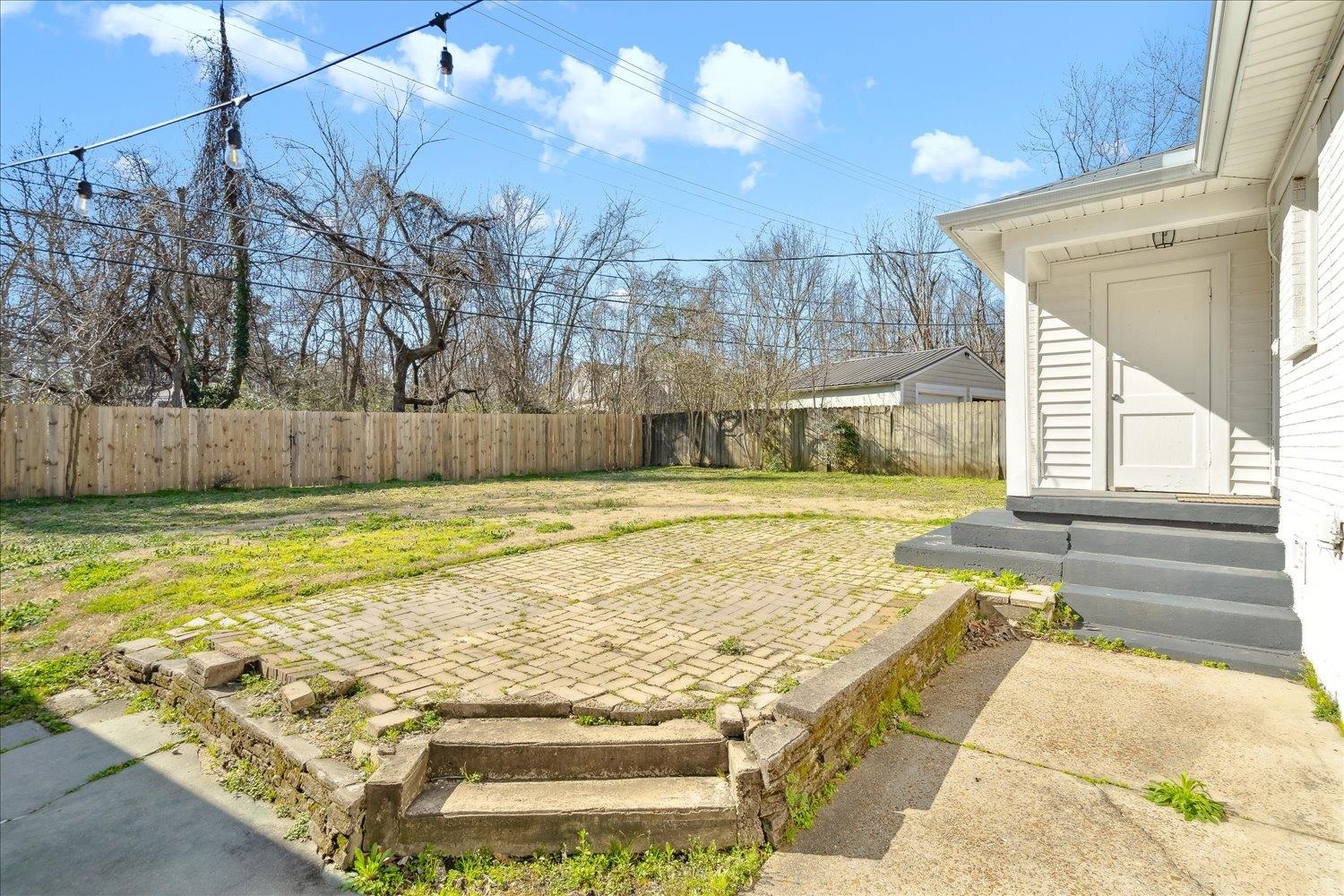 3901 Lytle Circle Memphis, TN 38122 - Photo 29 of 30 View of yard with entry steps, a patio, and a fenced backyard