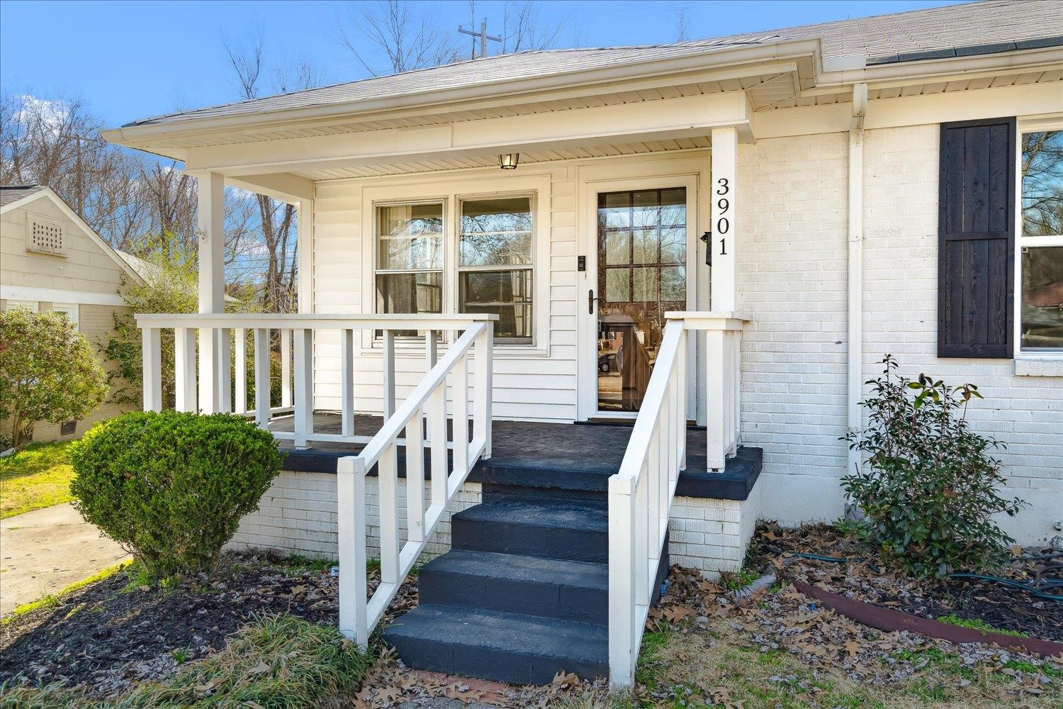 3901 Lytle Circle Memphis, TN 38122 - Photo 4 of 30 Property entrance with brick siding, a porch, and a shingled roof