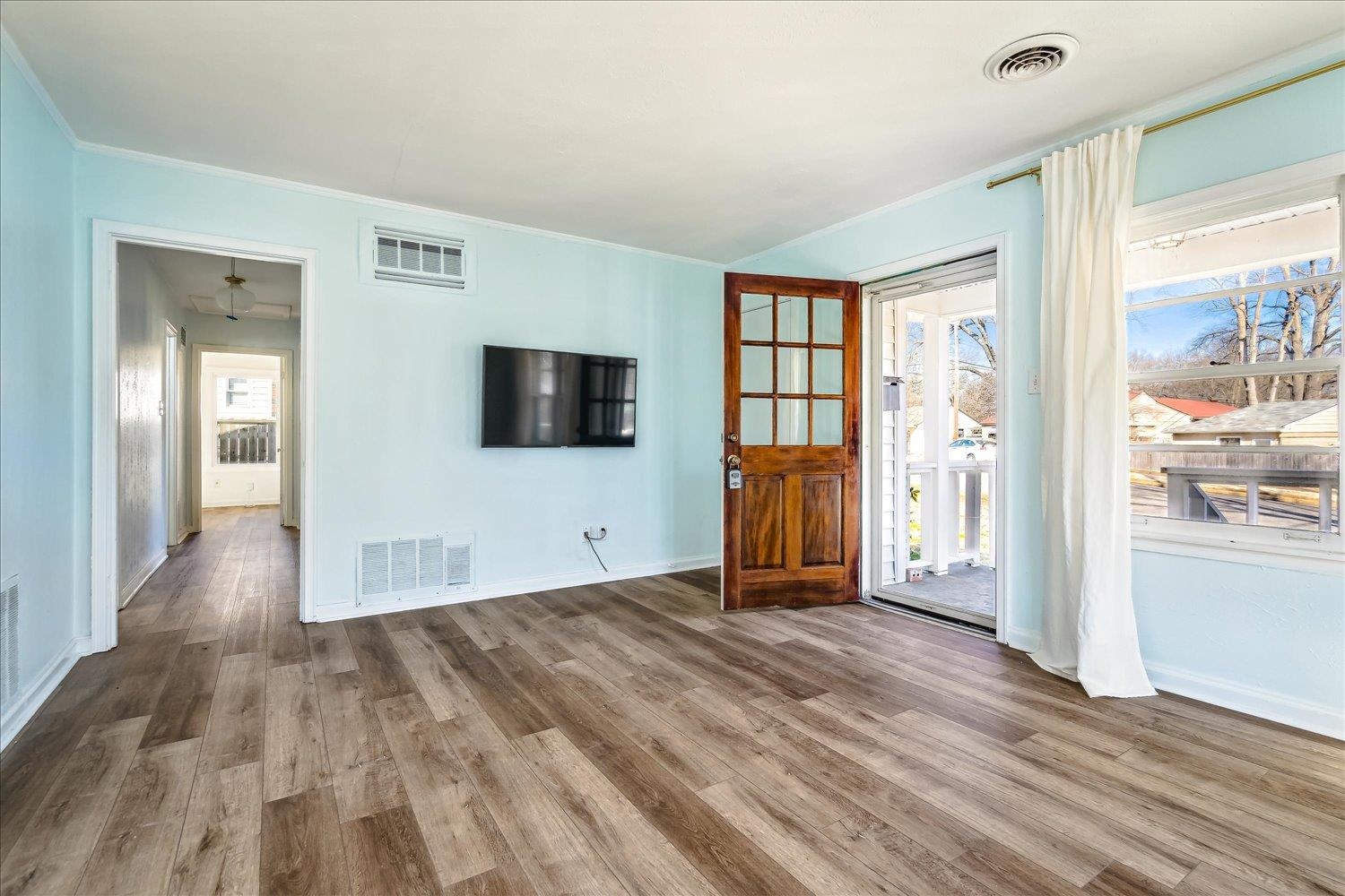 3901 Lytle Circle Memphis, TN 38122 - Photo 5 of 30 Unfurnished living room with wood finished floors and visible vents