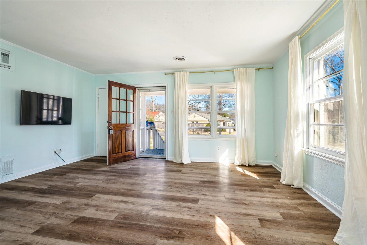 3901 Lytle Circle Memphis, TN 38122 - Photo 7 of 30 Unfurnished room featuring plenty of natural light, wood finished floors, and visible vents