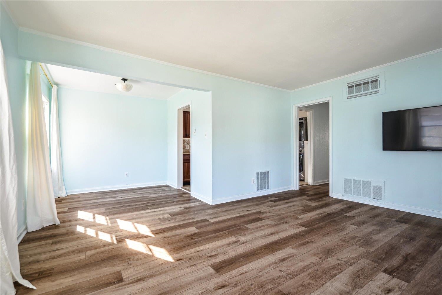 3901 Lytle Circle Memphis, TN 38122 - Photo 8 of 30 Spare room with visible vents, baseboards, and wood finished floors