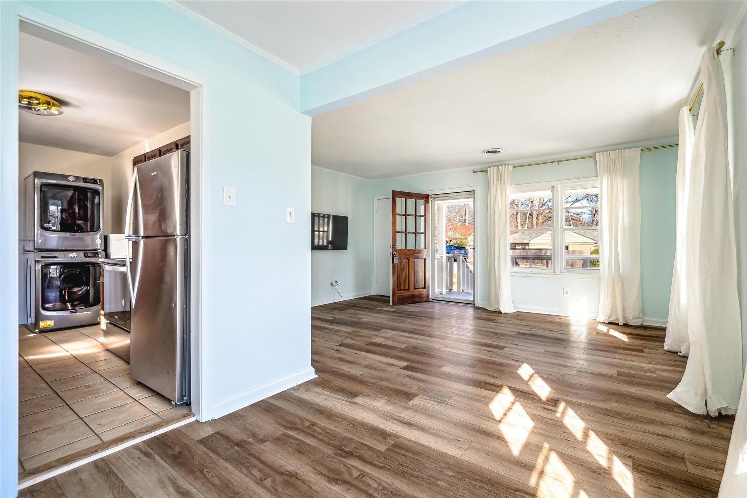 3901 Lytle Circle Memphis, TN 38122 - Photo 10 of 30 Interior space with ornamental molding, stacked washer / drying machine, baseboards, and wood finished floors