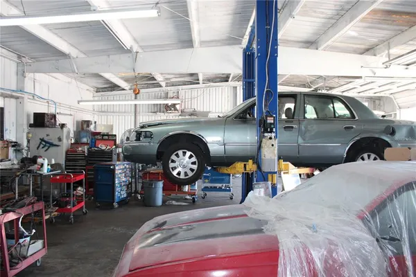 a utility room with dryer and bicycles