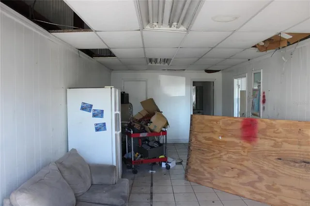 a bed room with a bed and a chandelier