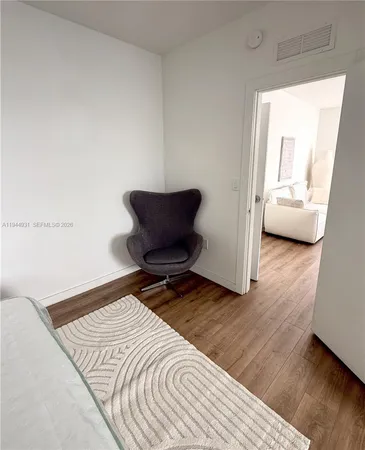 a bathroom with a double vanity sink and mirror with shower