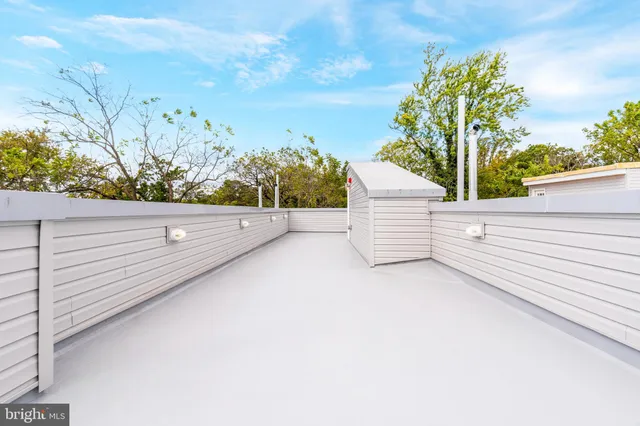a view of a swimming pool with an outdoor seating