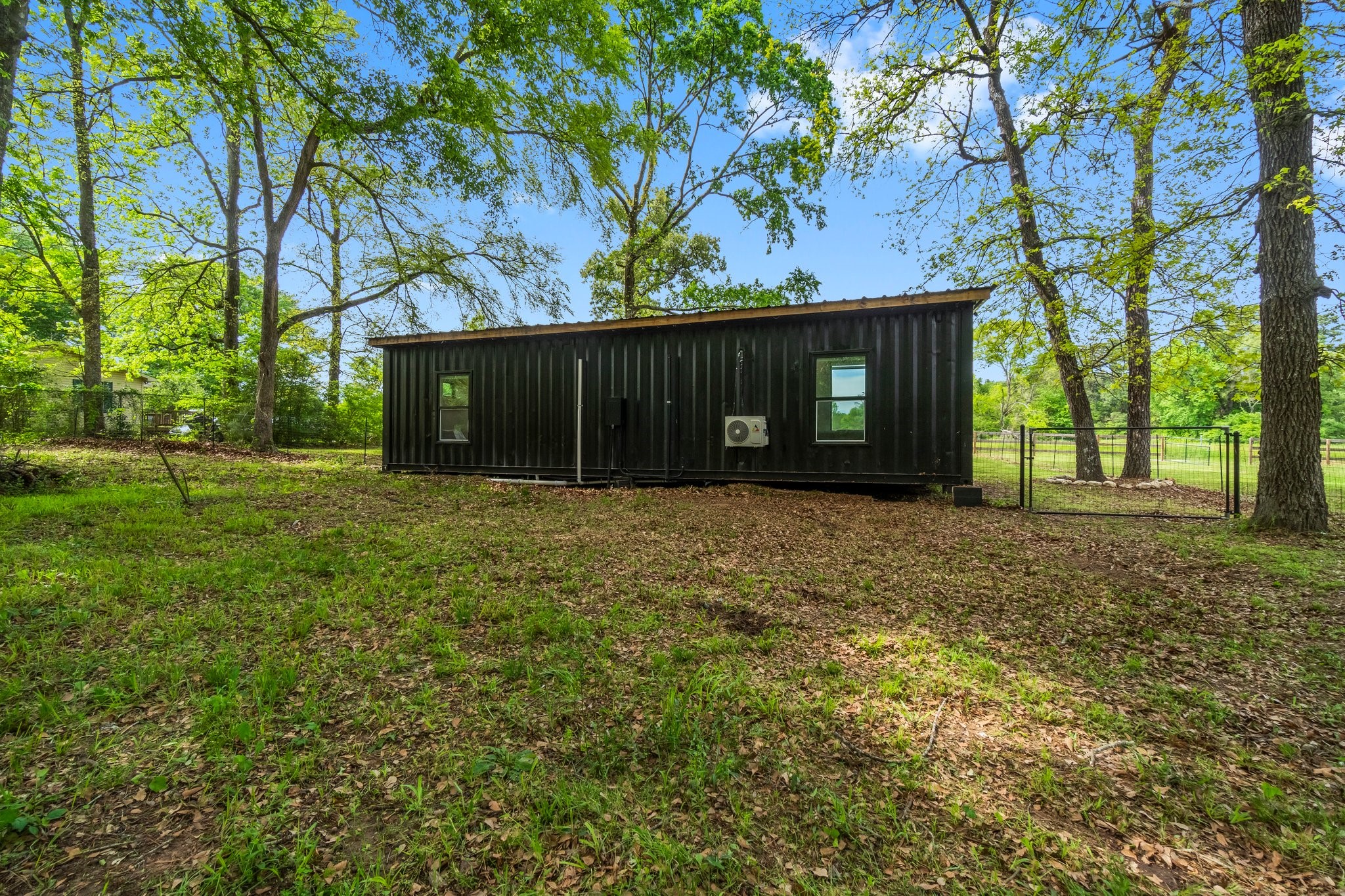 758 Jones Road New Waverly, TX 77358 - Photo 22 of 34 a front view of a house with a yard