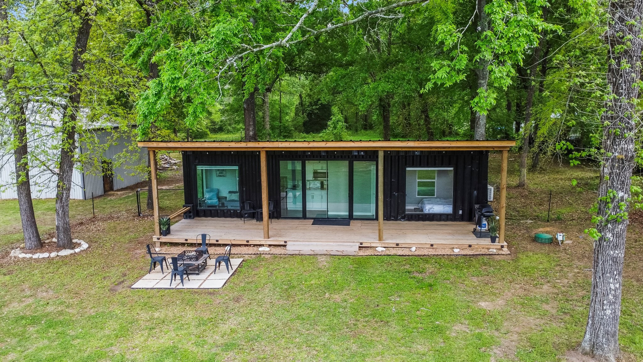 758 Jones Road New Waverly, TX 77358 - Photo 29 of 34 front view of a house with a yard and sitting area