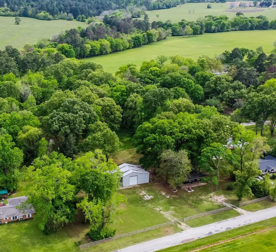 758 Jones Road New Waverly, TX 77358 - Photo 31 of 34 an aerial view of a houses with yard