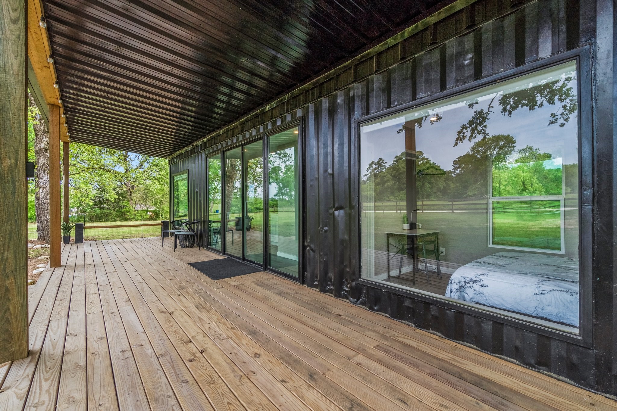 758 Jones Road New Waverly, TX 77358 - Photo 8 of 34 a view of a porch with wooden floor