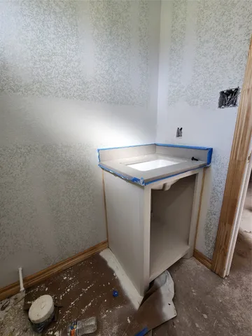 a bathroom with a shower curtain