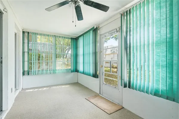 a view of room with window and furniture