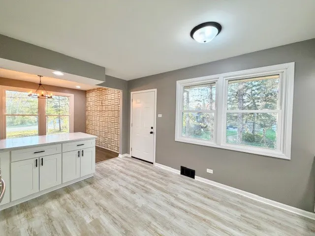 a large white room with a large window