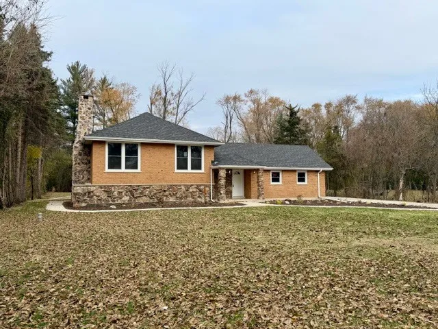 front view of a house with a yard