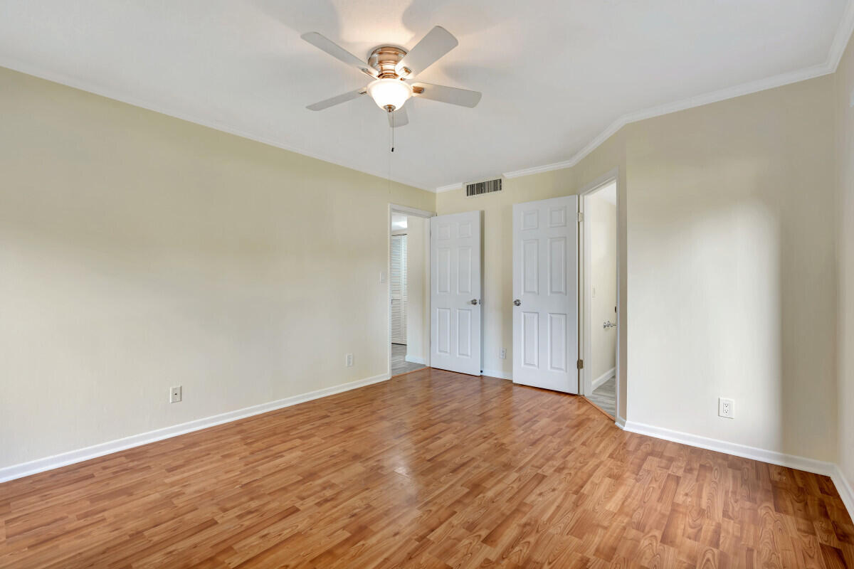 150 Pineview Road, Unit F3 Jupiter, FL 33469 - Photo 11 of 12 wooden floor in an empty room