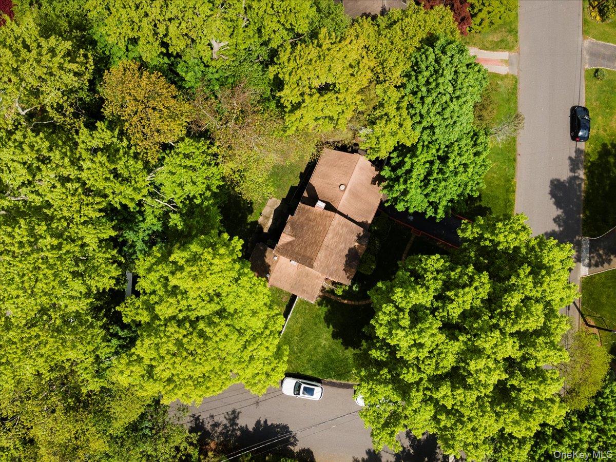 18 Nursery Road Melville, NY 11747 - Photo 11 of 17 an aerial view of a house with a yard