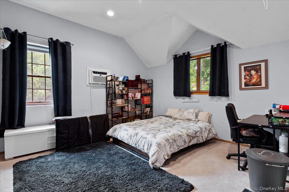 18 Nursery Road Melville, NY 11747 - Photo 9 of 17 a bedroom with a bed and a couch