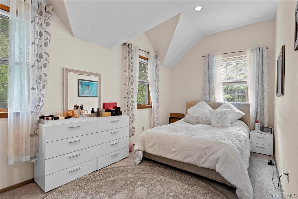 18 Nursery Road Melville, NY 11747 - Photo 10 of 17 a bedroom with a bed and a dresser