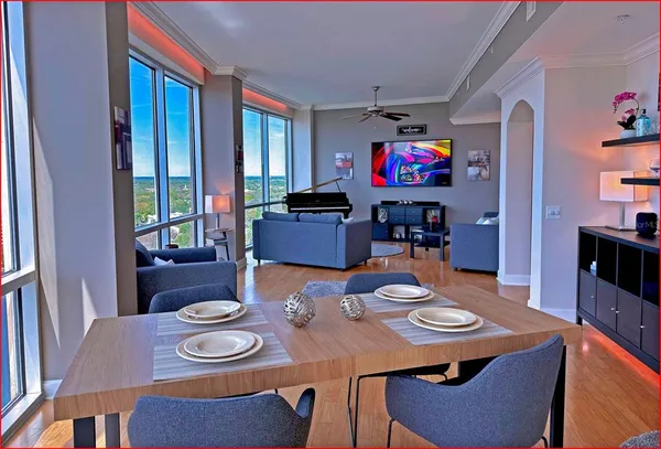 a view of a dining room with furniture and wooden floor
