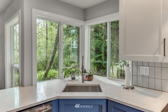 a view of a sink and a window