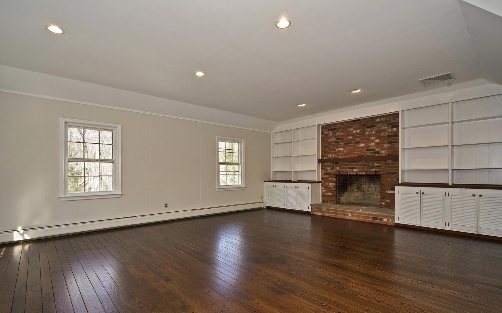 30 Mayapple Road Wilton, CT 06897 - Photo 12 of 24 a view of a livingroom with wooden floor and a window